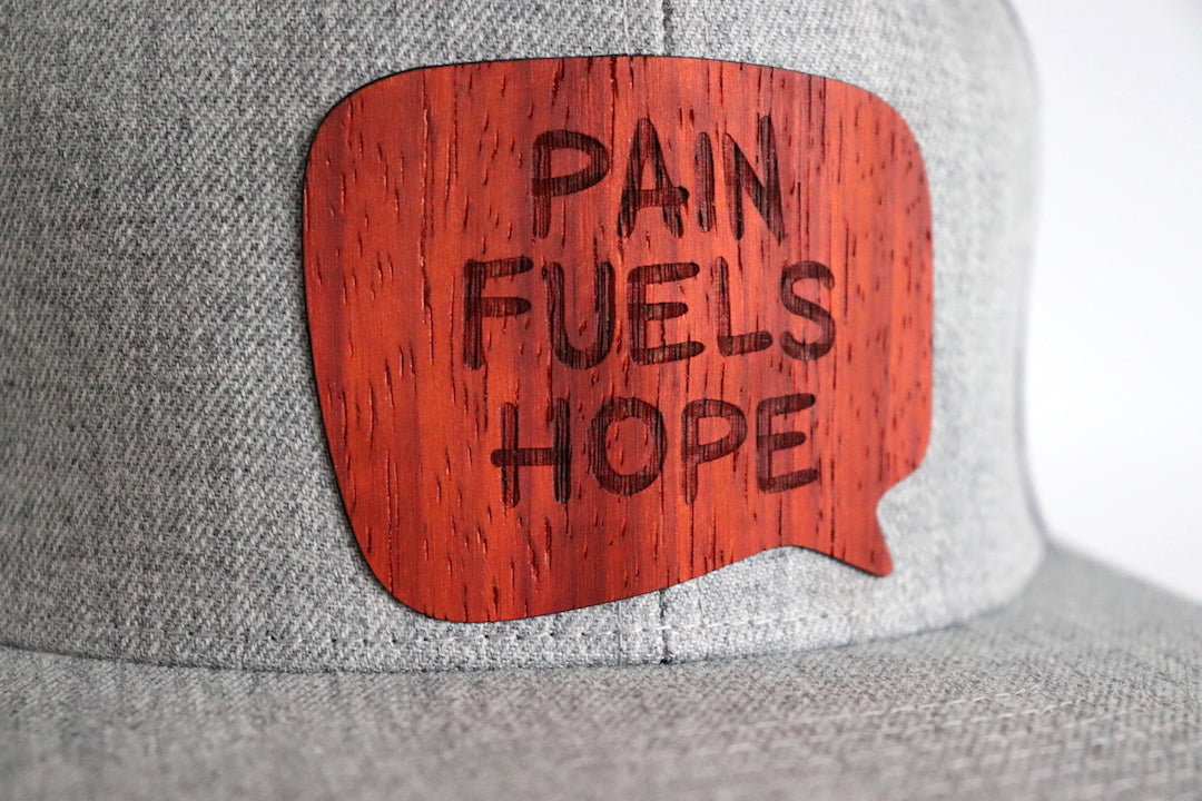 Pain fuels hope hat - Padauk wood